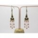 BOUCLES D'OREILLES AVEC ESTAMPES COULEUR BRONZE ET PERLES DE VERRE