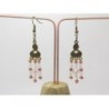 BOUCLES D'OREILLES AVEC ESTAMPES COULEUR BRONZE ET PERLES DE VERRE